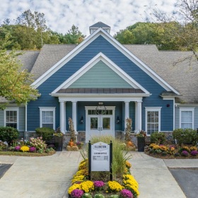 Settle into comfort at Ellington Metro West a building with a sign in front of it