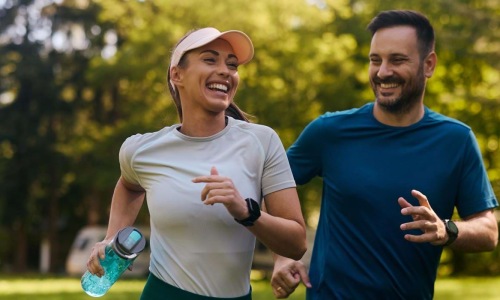 a man and woman running