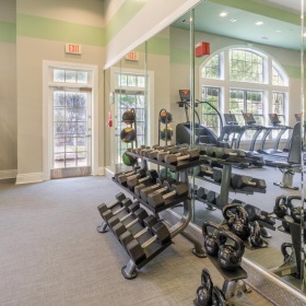 Cutting-edge amenities at your fingertips a gym with exercise equipment