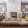 a room with a fireplace and couches
