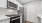 a kitchen with white cabinets