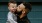 father holds and kisses his toddler son