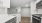 a kitchen with white cabinets