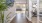 a room with a desk and a glass door