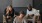 friends with food sit in a room together