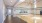 a glass walled room with wood floors